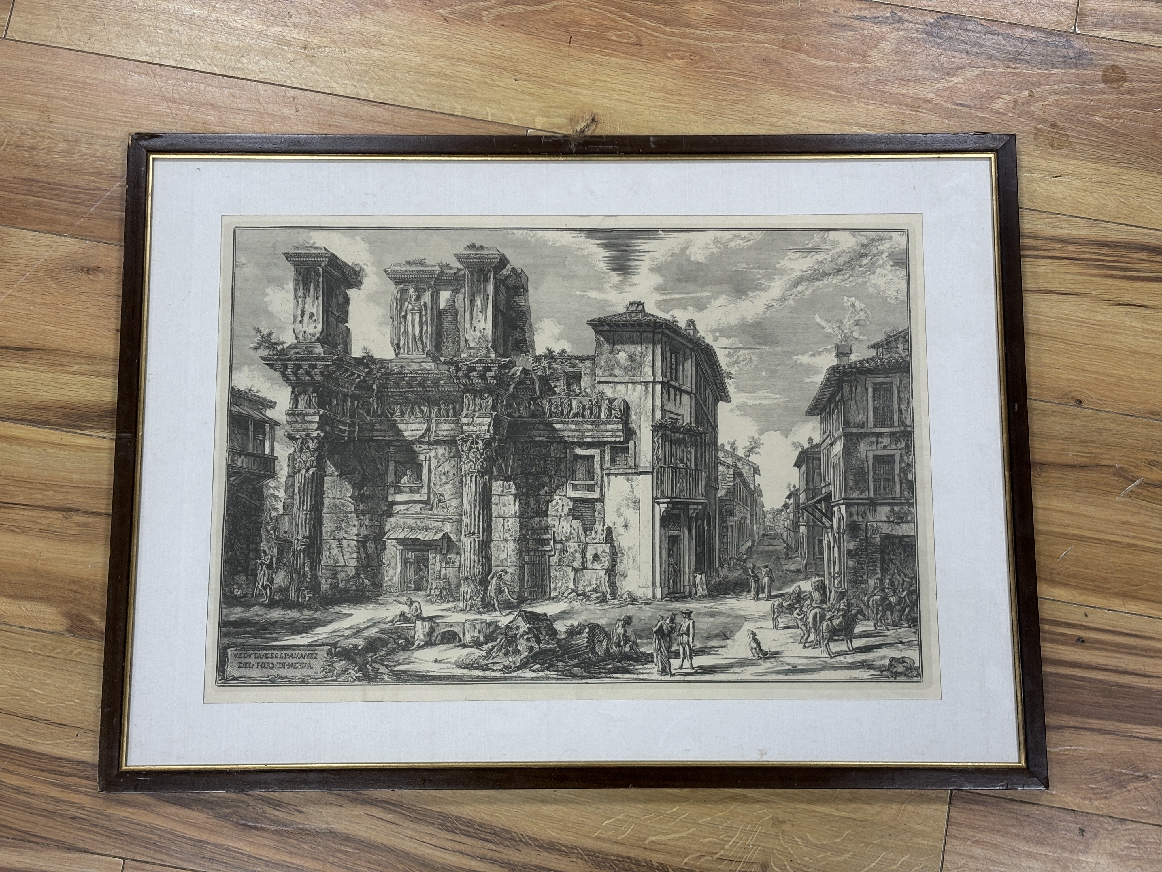 After Giovanni Battista Piranesi (Italian, 1720-1778), etching, ‘The Forum of Nerva with two half buried Corinthian columns’, signed in plate, 40 x 58cm